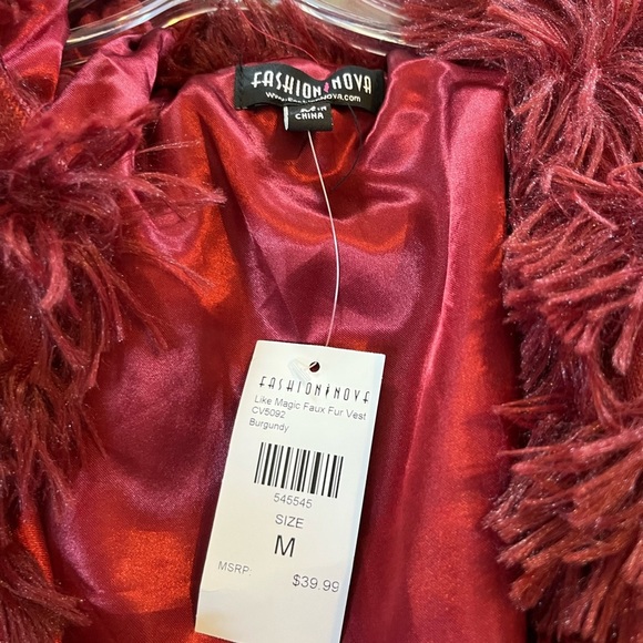 Red vest. Feathers? Fur? Not sure but really soft - Picture 3 of 3